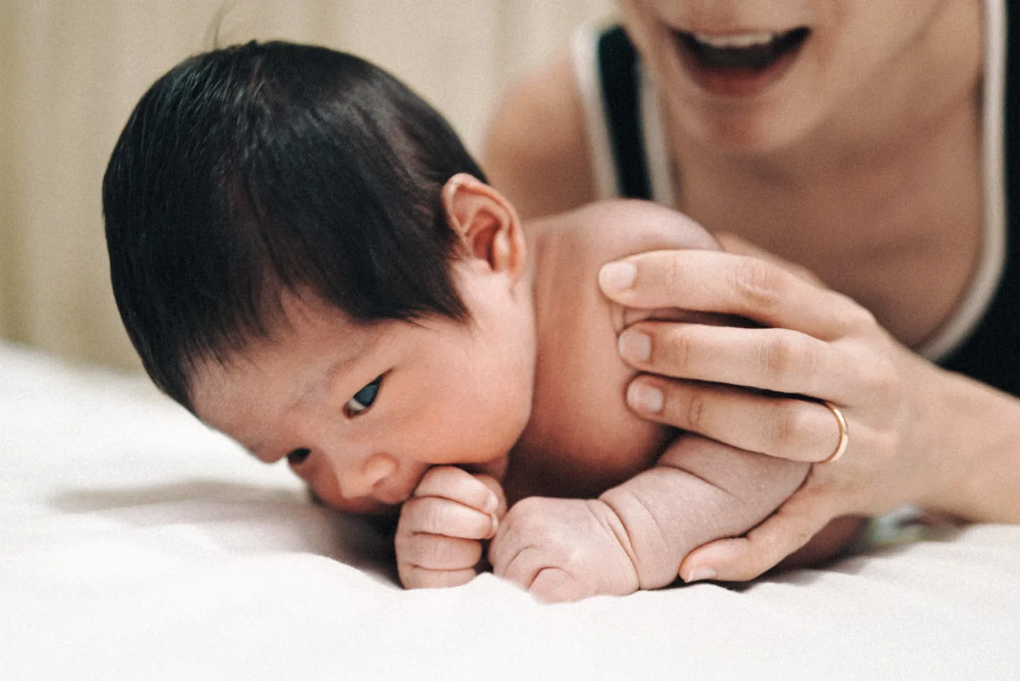 A mother and baby with a Goji physiotherapist during a combined Mummy and Baby assessment.
